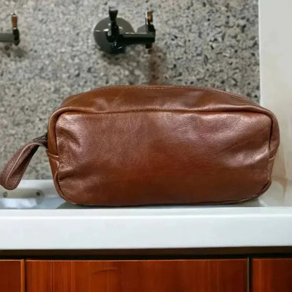 Light brown genuine leather shaving bag by Woesmooi with vintage design