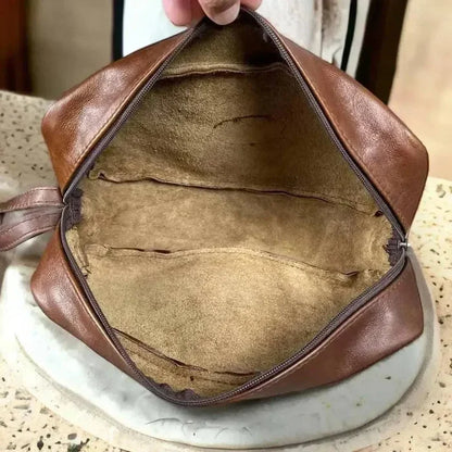 Light brown genuine leather shaving bag by Woesmooi with compact design