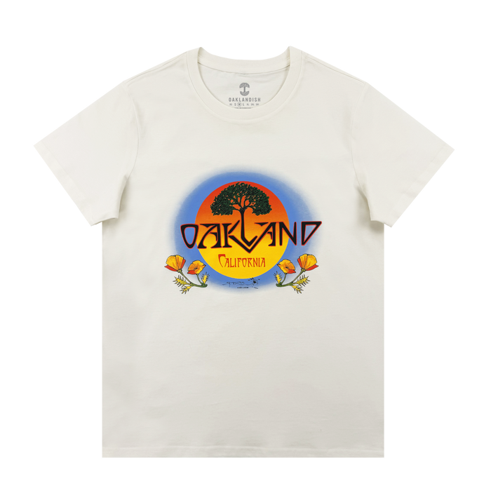 The Oaklandish Women's Vanguard Tee is a classic fit featuring a round sunset graphic with a black tree, bold "OAKLAND," "California" below, and orange poppies framing the border.