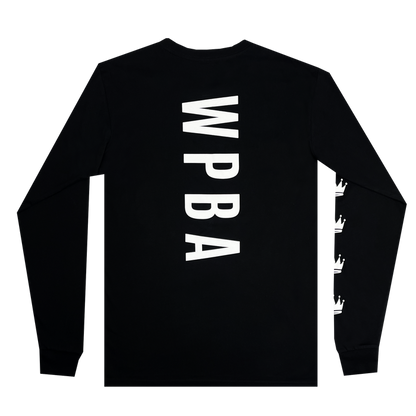 The WPBA Core LS Tee by Oaklandish is showcased in black. The back of this long-sleeve shirt features large white, vertically-aligned letters "WPBA," representing the Women's Premier Basketball Association. On the right sleeve, three white crowns are aligned horizontally near the cuff. The shirt has a simple and minimalist design that exudes empowerment in women's sports.