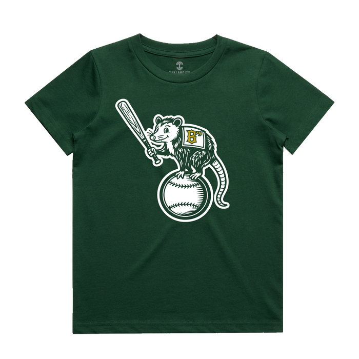 The Oakland Ballers Youth Clutch Tee is a dark green t-shirt showcasing a cartoon opossum wearing a vest with a yellow-detailed white “B,” standing proudly on a large baseball and holding a bat—a fun tribute to the pro baseball team.