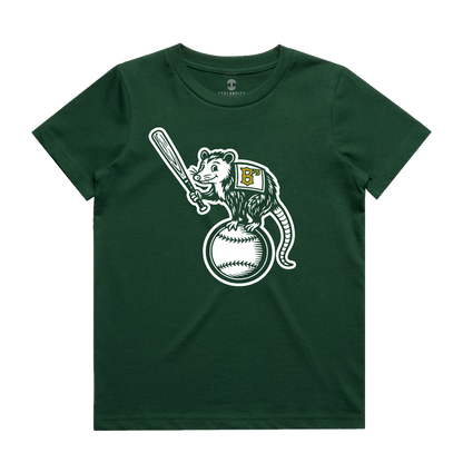 The Oakland Ballers Youth Clutch Tee is a dark green t-shirt showcasing a cartoon opossum wearing a vest with a yellow-detailed white “B,” standing proudly on a large baseball and holding a bat—a fun tribute to the pro baseball team.