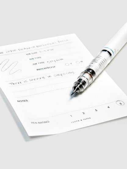 Close up on pencil nib with lead resting on its pen test sheet.